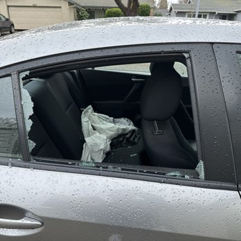 Smashed side window before repair